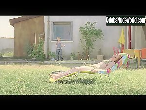 Adelaide Leroux Sunbathing , Topless in Home (2008) 5